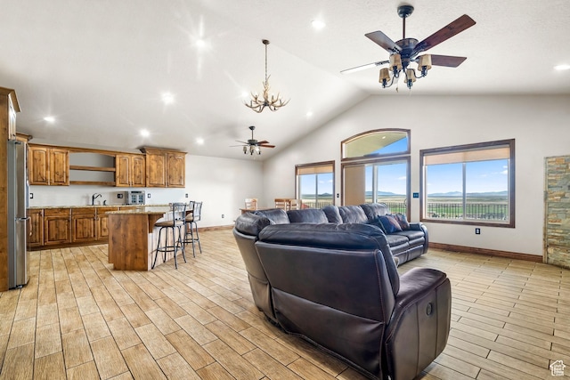 2521 W Ridgeline Rd, Stockton, UT 84071 - living area featuring a ceiling fan, light wood-style flooring, lofted ceiling, baseboards, and recessed lighting