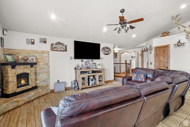 2521 W Ridgeline Rd, Stockton, UT 84071 - living room featuring arched walkways, ceiling fan, wood finished floors, lofted ceiling, and a fireplace