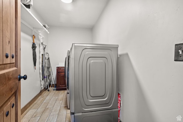 2521 W Ridgeline Rd, Stockton, UT 84071 - walk in closet with light wood finished floors and washing machine and clothes dryer