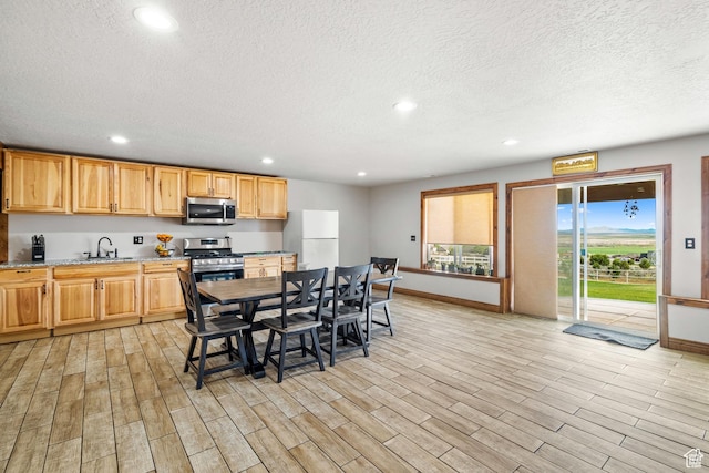 2521 W Ridgeline Rd, Stockton, UT 84071 - dining room with recessed lighting, a textured ceiling, baseboards, and light wood-type flooring