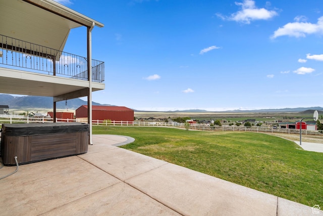 2521 W Ridgeline Rd, Stockton, UT 84071 - view of yard featuring a hot tub, a mountain view, a patio area, and a rural view