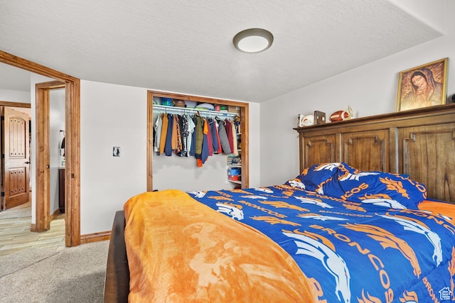 2521 W Ridgeline Rd, Stockton, UT 84071 - bedroom featuring a closet, light carpet, and a textured ceiling