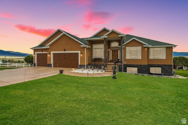 2521 W Ridgeline Rd, Stockton, UT 84071 - ranch-style house featuring concrete driveway, a garage, stucco siding, and stone siding