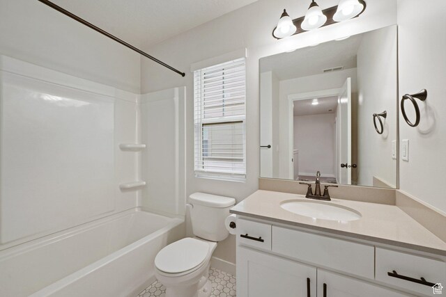 11413 S Kitty Hawk Rd W, South Jordan, UT 84009 - bathroom featuring toilet, vanity, shower / tub combination, and baseboards