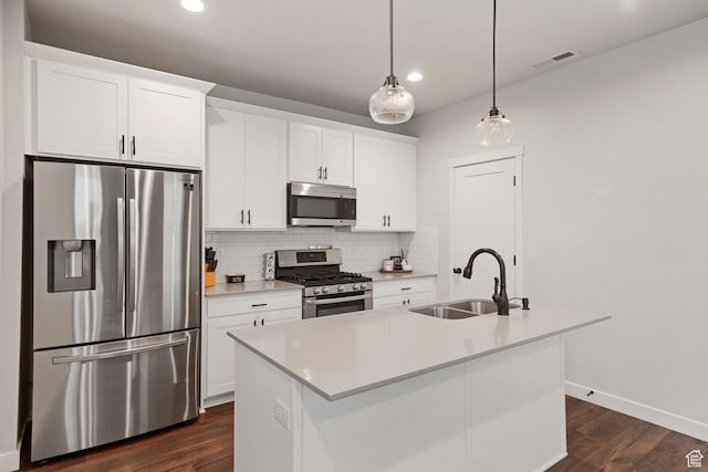 11413 S Kitty Hawk Rd W, South Jordan, UT 84009 - kitchen featuring appliances with stainless steel finishes, a sink, decorative backsplash, white cabinets, and recessed lighting