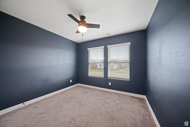 11413 S Kitty Hawk Rd W, South Jordan, UT 84009 - unfurnished room featuring a ceiling fan, carpet floors, baseboards, and a textured ceiling