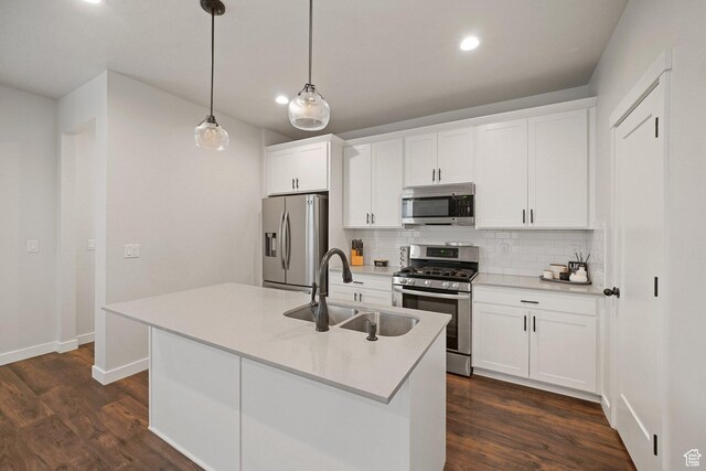 11413 S Kitty Hawk Rd W, South Jordan, UT 84009 - kitchen with stainless steel appliances, a sink, backsplash, dark wood-style floors, and recessed lighting
