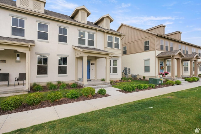 11413 S Kitty Hawk Rd W, South Jordan, UT 84009 - view of property featuring a front yard, stucco siding, and cooling unit