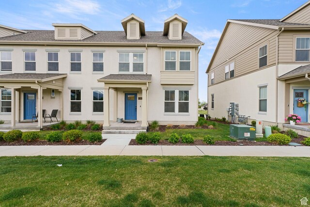 11413 S Kitty Hawk Rd W, South Jordan, UT 84009 - townhome / multi-family property featuring a front lawn, a shingled roof, and stucco siding