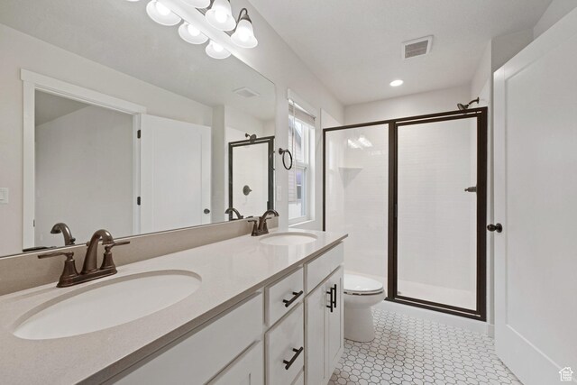 11413 S Kitty Hawk Rd W, South Jordan, UT 84009 - full bathroom with a shower stall, toilet, double vanity, and recessed lighting