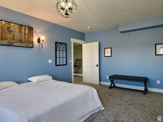 123 Red Hawk Ave, Evanston, WY 82930 - carpeted bedroom with a chandelier, baseboards, and a textured ceiling