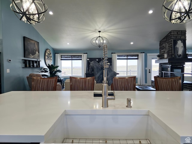 123 Red Hawk Ave, Evanston, WY 82930 - kitchen featuring open floor plan, a chandelier, recessed lighting, a stone fireplace, and light countertops
