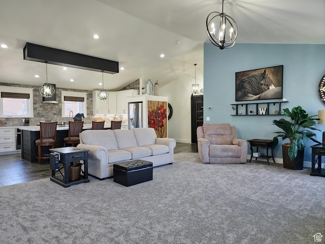 123 Red Hawk Ave, Evanston, WY 82930 - living room with lofted ceiling, a chandelier, and recessed lighting