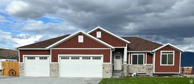 3017 W Ridgeline Rd, Stockton, UT 84071 - craftsman-style home featuring stone siding, concrete driveway, an attached garage, and board and batten siding