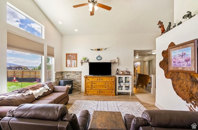 3017 W Ridgeline Rd, Stockton, UT 84071 - living room featuring ceiling fan, a wood stove, wood finished floors, high vaulted ceiling, and recessed lighting