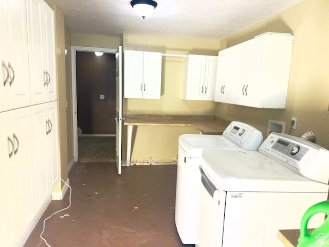 laundry area with cabinet space, washer and clothes dryer, and baseboards