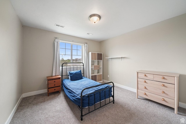 bedroom with carpet and baseboards
