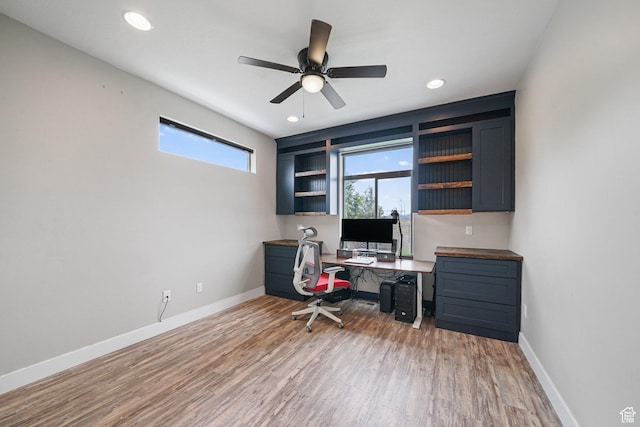 office space featuring light wood-style flooring, baseboards, a ceiling fan, and recessed lighting