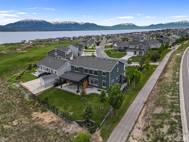 aerial perspective of suburban area featuring a water and mountain view