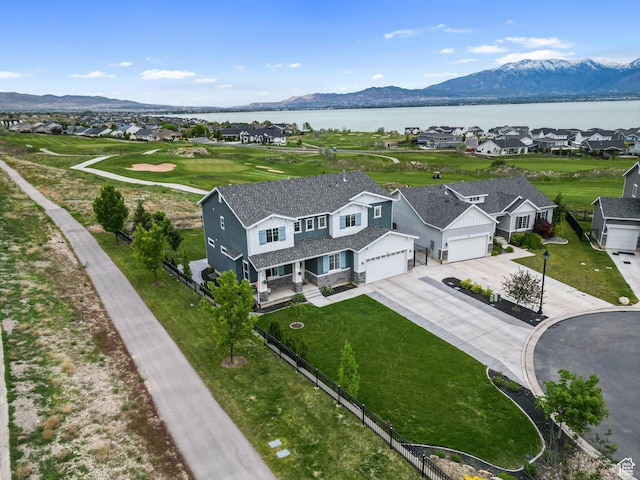 aerial view of residential area with a water and mountain view