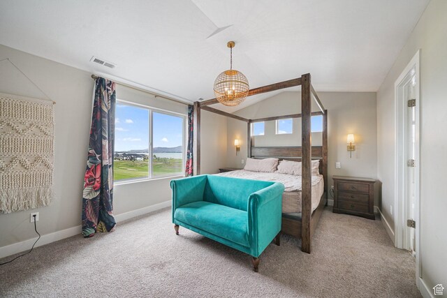 bedroom with carpet, vaulted ceiling, baseboards, and a chandelier