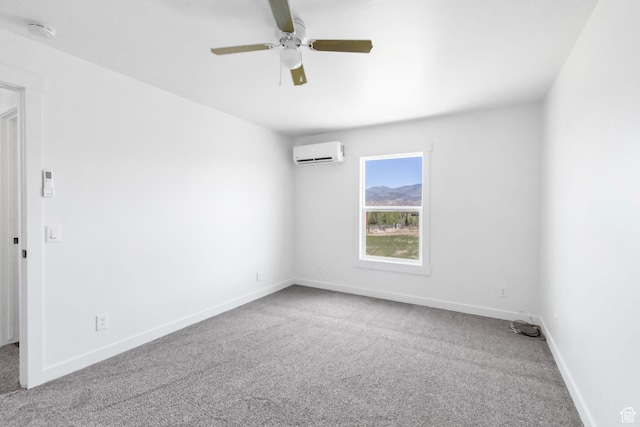 1665 S Kennedy Dr, Marysvale, UT 84750 - carpeted spare room featuring a wall unit AC, a smoke detector, a ceiling fan, and baseboards