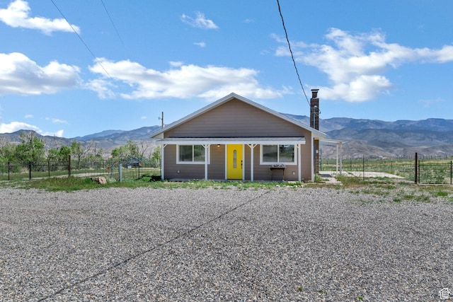 1665 S Kennedy Dr, Marysvale, UT 84750 - bungalow-style home with a mountain view, fence, and a porch