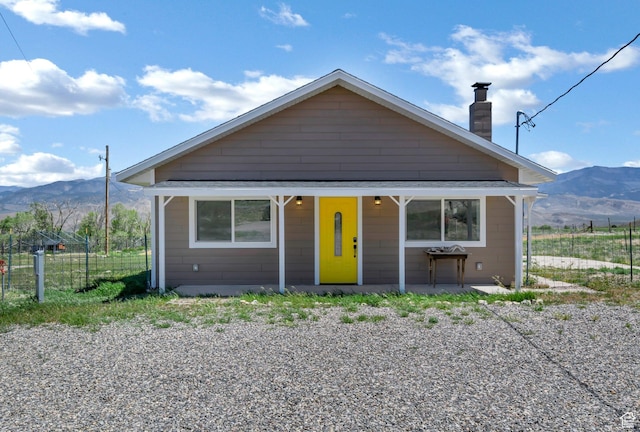 1665 S Kennedy Dr, Marysvale, UT 84750 - bungalow-style house featuring a mountain view, a chimney, and fence