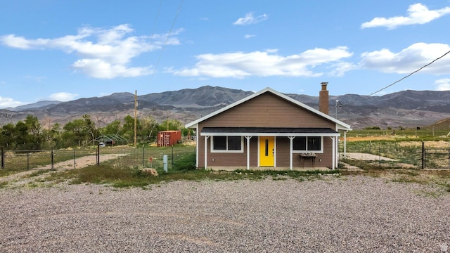 1665 S Kennedy Dr, Marysvale, UT 84750 - view of front of house featuring a mountain view, fence, and a porch