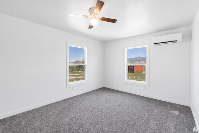 1665 S Kennedy Dr, Marysvale, UT 84750 - empty room featuring a wall unit AC, dark carpet, a ceiling fan, and baseboards