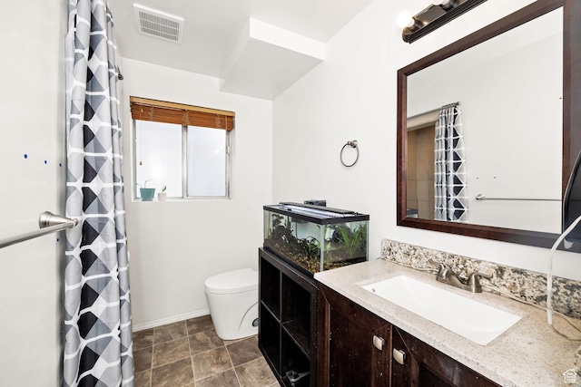 910 W 370 S, Logan, UT 84321 - bathroom with toilet, baseboards, vanity, and a shower with shower curtain