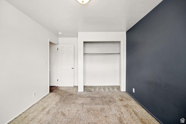 910 W 370 S, Logan, UT 84321 - unfurnished bedroom featuring carpet flooring, a closet, and baseboards