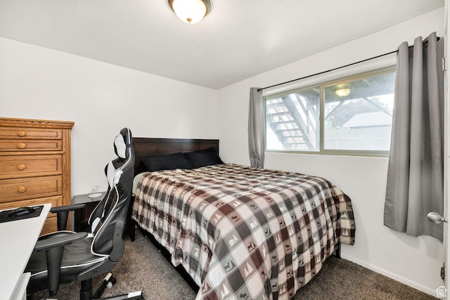 910 W 370 S, Logan, UT 84321 - bedroom featuring dark carpet and baseboards