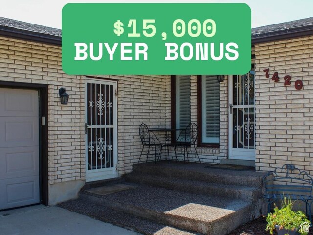 7420 S 1025 E, South Weber, UT 84405 - view of exterior entry with brick siding and a shingled roof