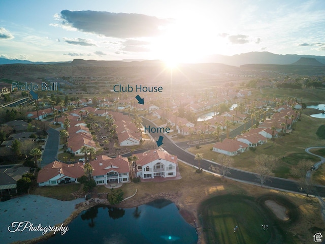 aerial perspective of suburban area with a water and mountain view