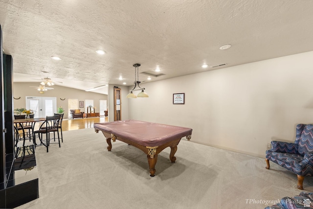 game room featuring lofted ceiling, pool table, recessed lighting, a textured ceiling, and light colored carpet