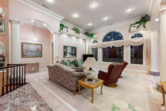 carpeted living room featuring ornate columns, recessed lighting, crown molding, and baseboards