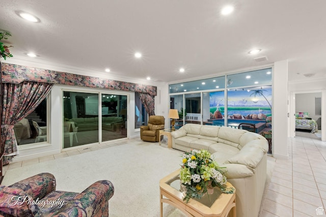 tiled living area with ornamental molding and recessed lighting