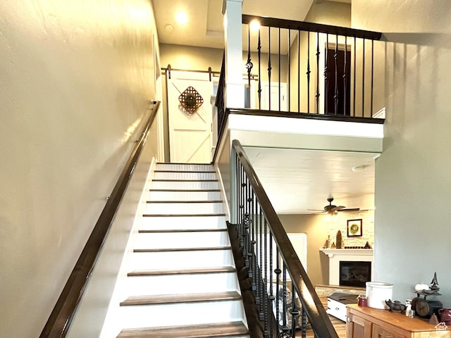 358 E 2970 S, Naples, UT 84078 - stairs featuring ceiling fan and a glass covered fireplace