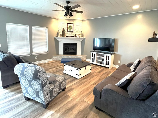 358 E 2970 S, Naples, UT 84078 - living area featuring ceiling fan, a glass covered fireplace, wood finished floors, wood ceiling, and baseboards