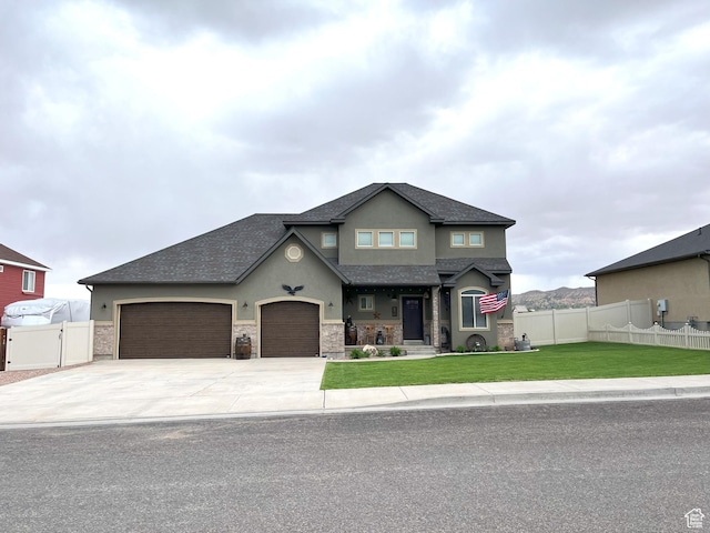 358 E 2970 S, Naples, UT 84078 - view of front of property with stucco siding, concrete driveway, a garage, a shingled roof, and stone siding