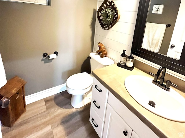 358 E 2970 S, Naples, UT 84078 - bathroom featuring vanity, wood finished floors, toilet, and baseboards