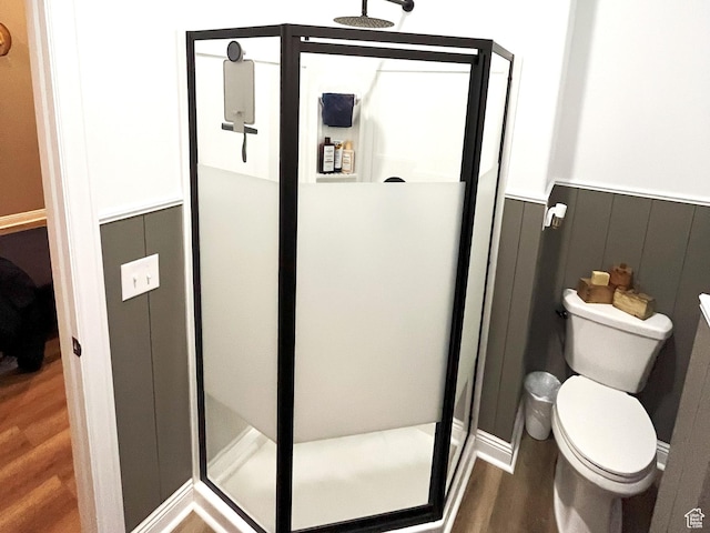 358 E 2970 S, Naples, UT 84078 - bathroom featuring wood finished floors, a shower stall, toilet, and wainscoting