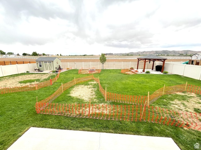 358 E 2970 S, Naples, UT 84078 - view of yard featuring a gazebo, a shed, an outbuilding, and a vegetable garden