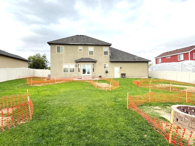 358 E 2970 S, Naples, UT 84078 - back of property featuring a vegetable garden, stucco siding, a shingled roof, and a fire pit