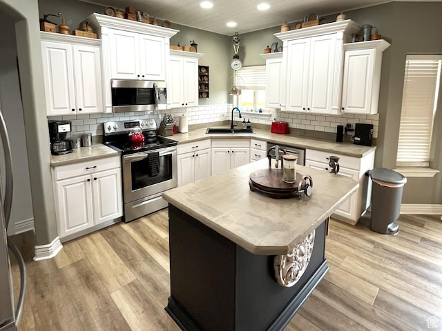 358 E 2970 S, Naples, UT 84078 - kitchen featuring stainless steel appliances, a sink, recessed lighting, white cabinets, and light wood-style floors