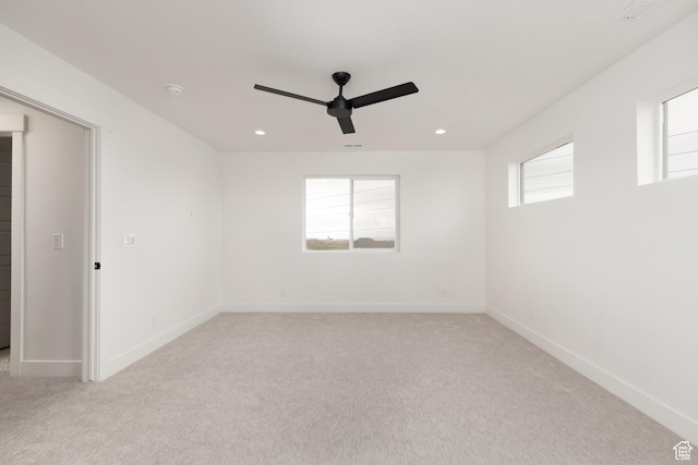 spare room featuring ceiling fan, light colored carpet, baseboards, recessed lighting, and a smoke detector