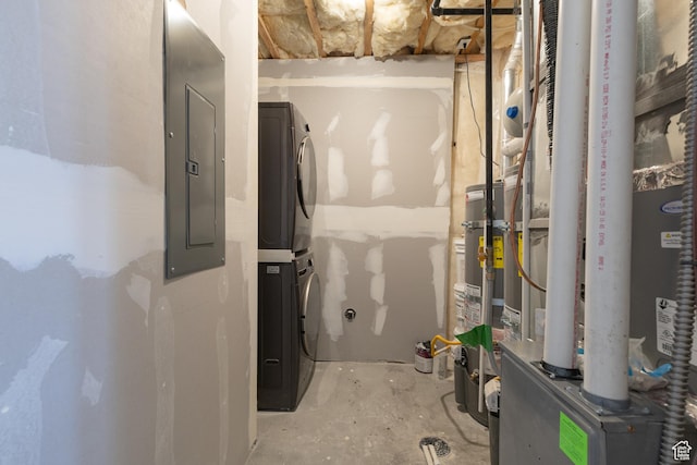 utilities with stacked washer / drying machine, electric panel, and heating unit
