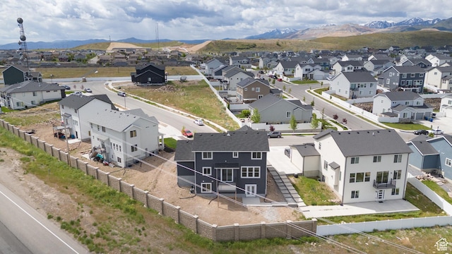aerial view of residential area featuring mountains