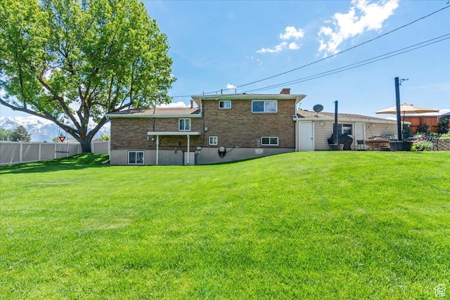 rear view of house featuring brick siding